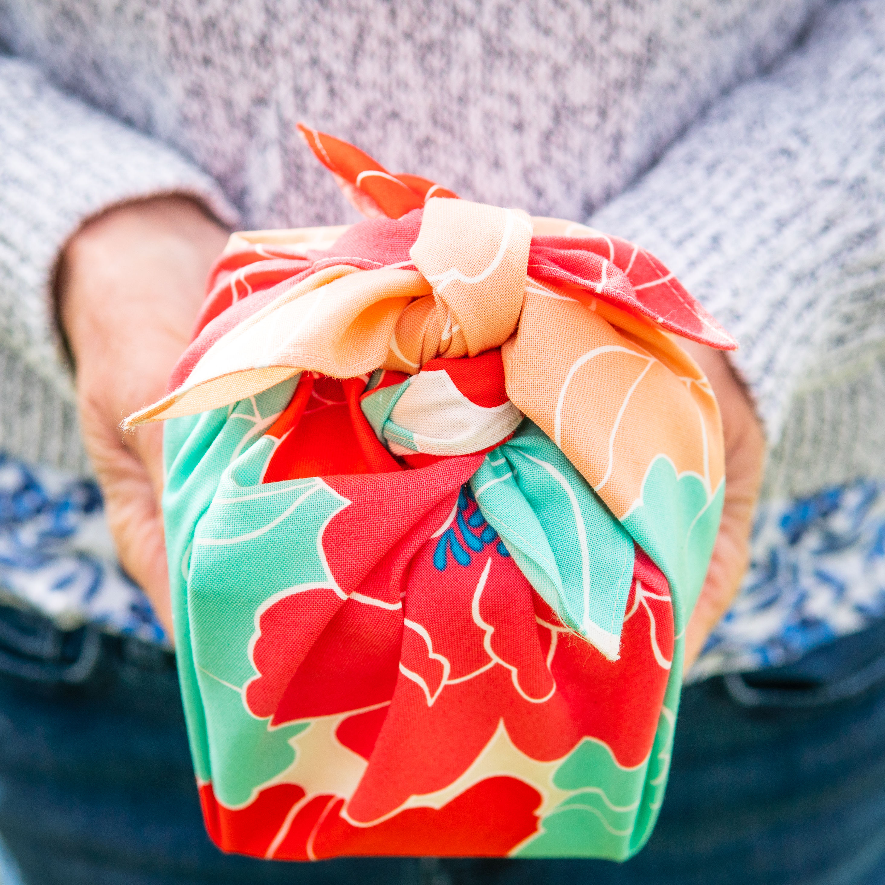 Peony furoshiki gift wrapped present being held
