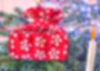 a furoshiki gift wrapped present in a christmas tree