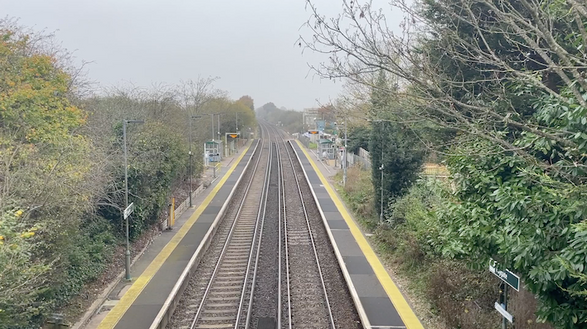 The view from the bridge, looking down onto the tracks with run through the centre of the image.