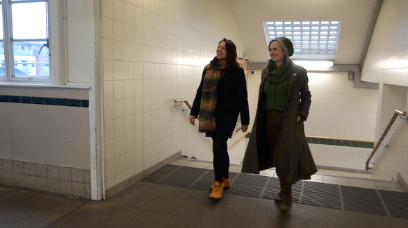 Annalees and Luna are walking up some stairs, to the station platform.