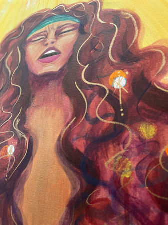Detail of the figure's face and neck, highlighting the metallic gold paint reflecting details in hair. 