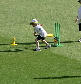 child playing cricket