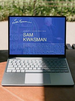 This image depicts a laptop computer viewing Sam Kwasman's website.