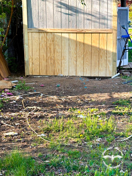 Unfinished wood siding and yard