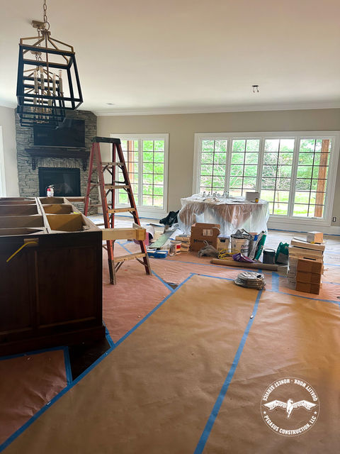 Home under construction, showing cabinets and painting supplies