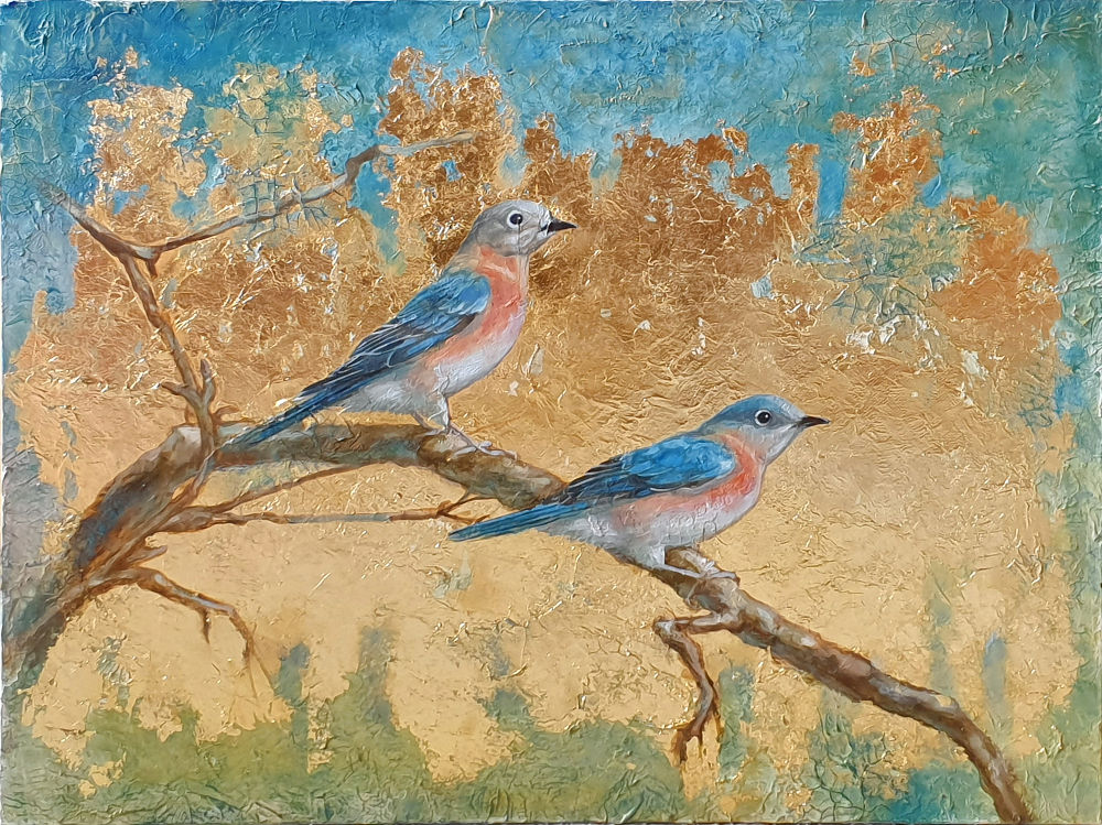two blue birds on a branch take from the side, looking forward on a gold leaf background, with blue and green