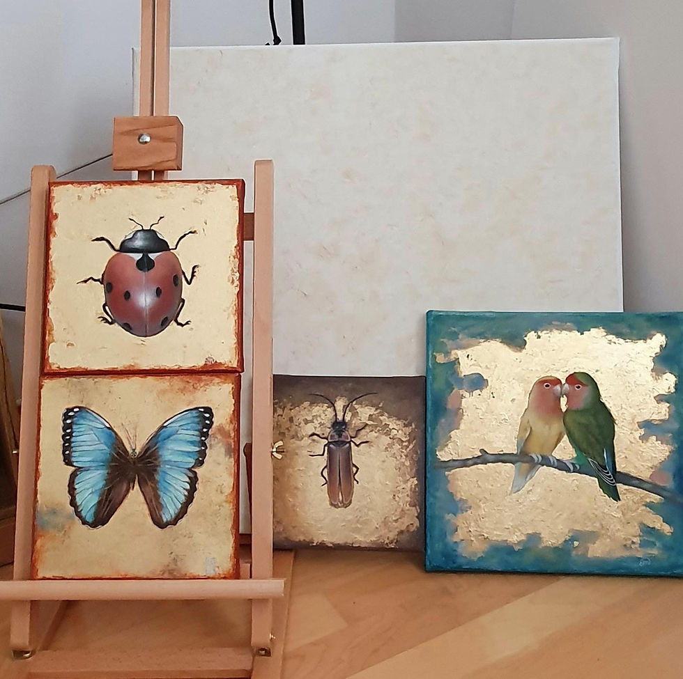 Eleonora Martorana Studio view, four paintings in progress. A ladybug on gold leaf. A blue butterfly on gold leaf. Two lovebirds on gold leaf. A firefly on gold leaf