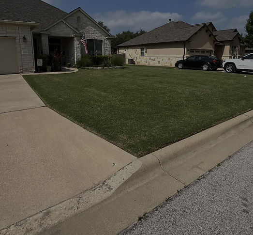 Front yard landscaping installation with mulch and plants in Temple TX