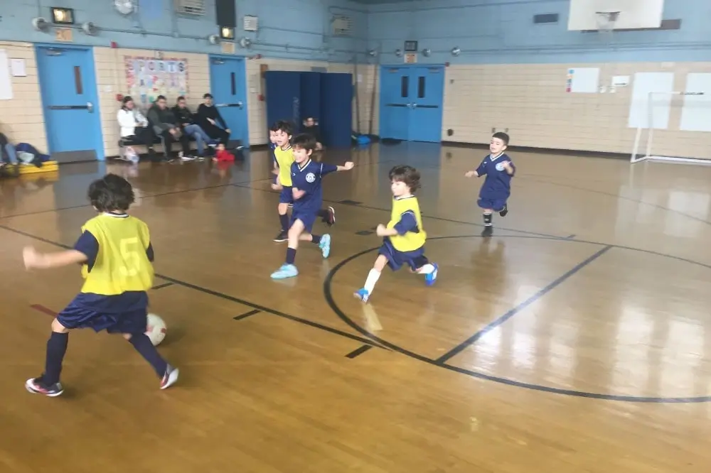 soccer players dressed in yellow controlling the ball.