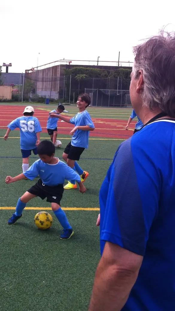soccer players in light blue jerseys