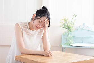 体調の悪そうな女性