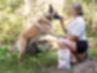 Julia with her Border Collie–Belgian Malinois mix, Kilo, and Belgian Malinois, Hex, enjoying the outdoors together.