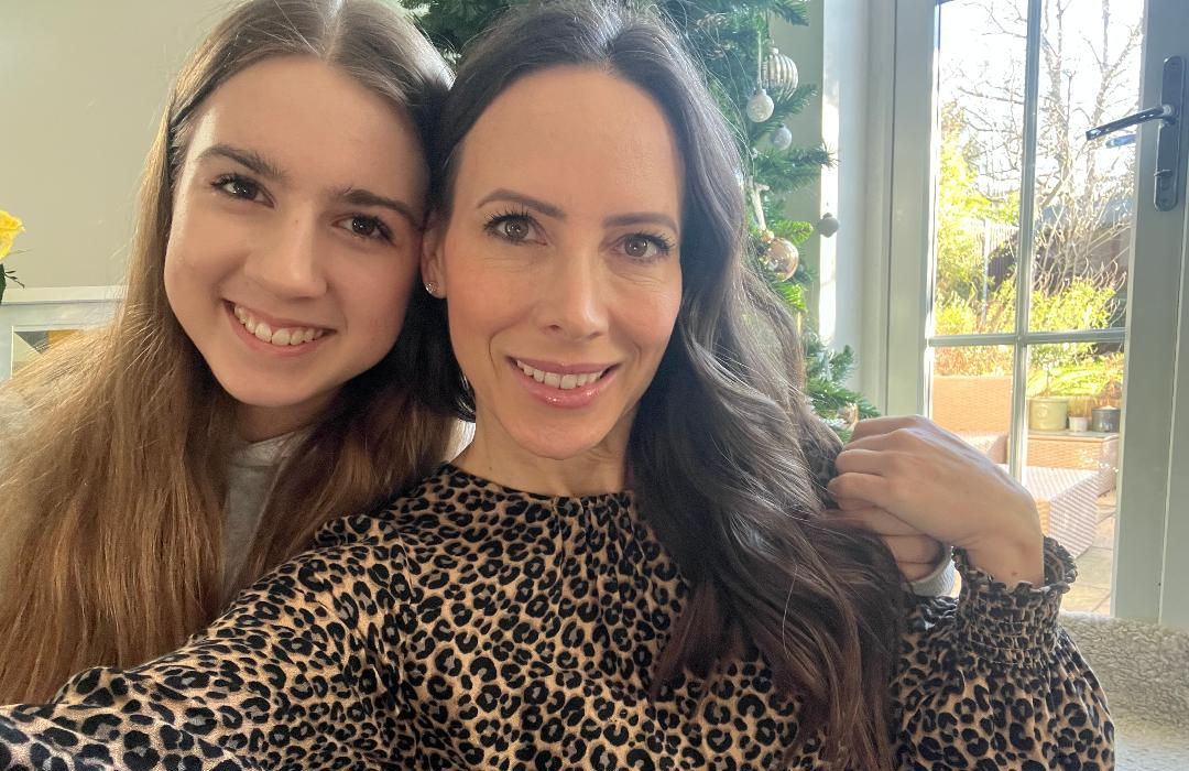 Two women smiling.