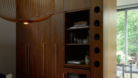 modern living area with walnut cabinets