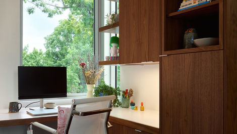 modern home office with walnut cabinets