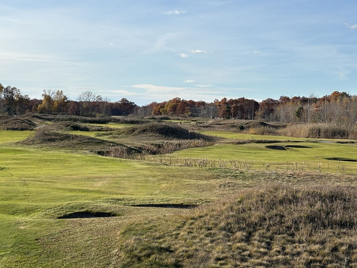 Autumn view of The Gailes golf course at Lakewood Shores, featuring rolling fairways, sand bunkers, and vibrant fall foliage under a clear sky.