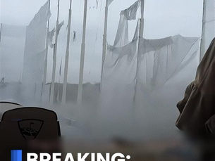 Collapsed netting at Topgolf Auburn Hills during a winter storm, showing torn safety nets and snowy conditions.