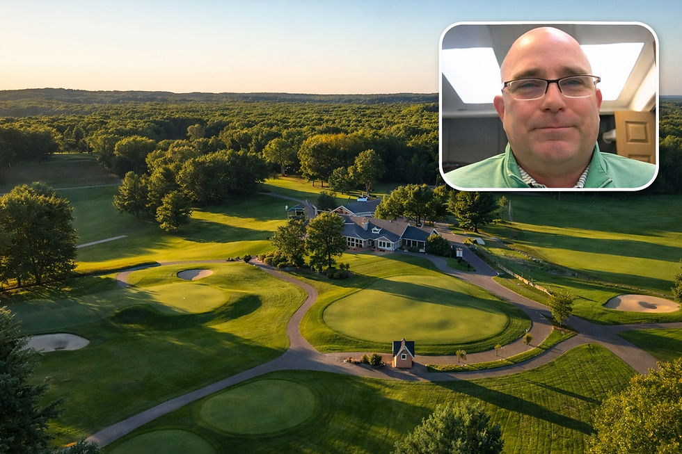 A high-angle aerial drone view of the clubhouse, practice greens, and surrounding forested golf holes at Pilgrim's Run Golf Club during golden hour, featuring a rounded rectangular video frame inset in the upper right showing Director of Golf Michael Rey in a green pullover.