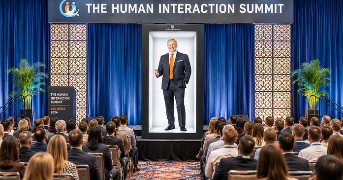 Life-size digital executive presenting through a Holoconnects Holobox at a corporate conference