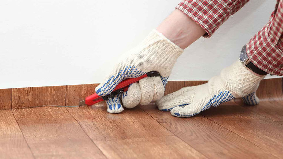 hand-cutting-vinyl-flooring-97876322.jpg