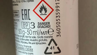 Etiketa aerosolu s výstražným symbolem