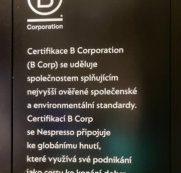 Greenwashing nápis Nespresso, Nestlé.