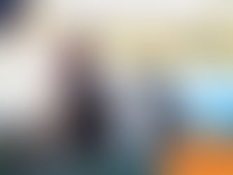 A person and a dog sit by a lake, sharing a moment under a tree. The dog gazes up. Text reads "wilsons HEALTH" in orange and blue.