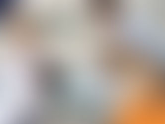 Veterinarian with tablet consults man holding a golden retriever on exam table. Vet clinic setting, logos in corners, calm mood.