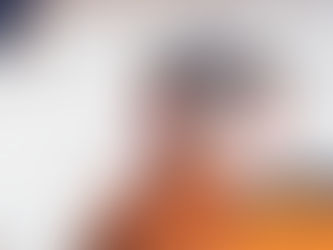 Hands gently hold a small black and tan dog outdoors. The person wears a brown jacket. "Wilsons Health" logo is visible. Snowy background.