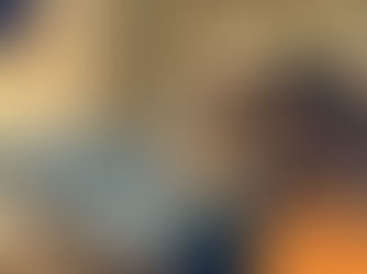 Brown dog resting on a blue cushion in a softly lit room, with "Wilsons Health" logo in the corner. Calm and relaxed mood.