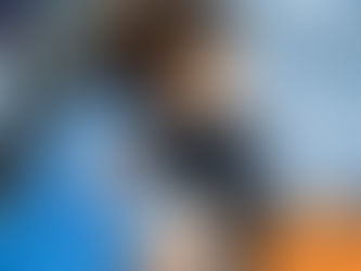 Woman in blue scrubs hugs a happy black and white dog. Text: "Wilsons Health" on orange bubble. Calm, caring mood in a clinic.