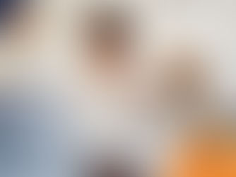 Woman smiles as a dog licks her hand. They're seated at a desk with a laptop. Warm, cozy setting with a logo reading "wilsons HEALTH".