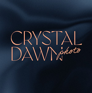 Crystal Dawn Photo logo on blue silk background.