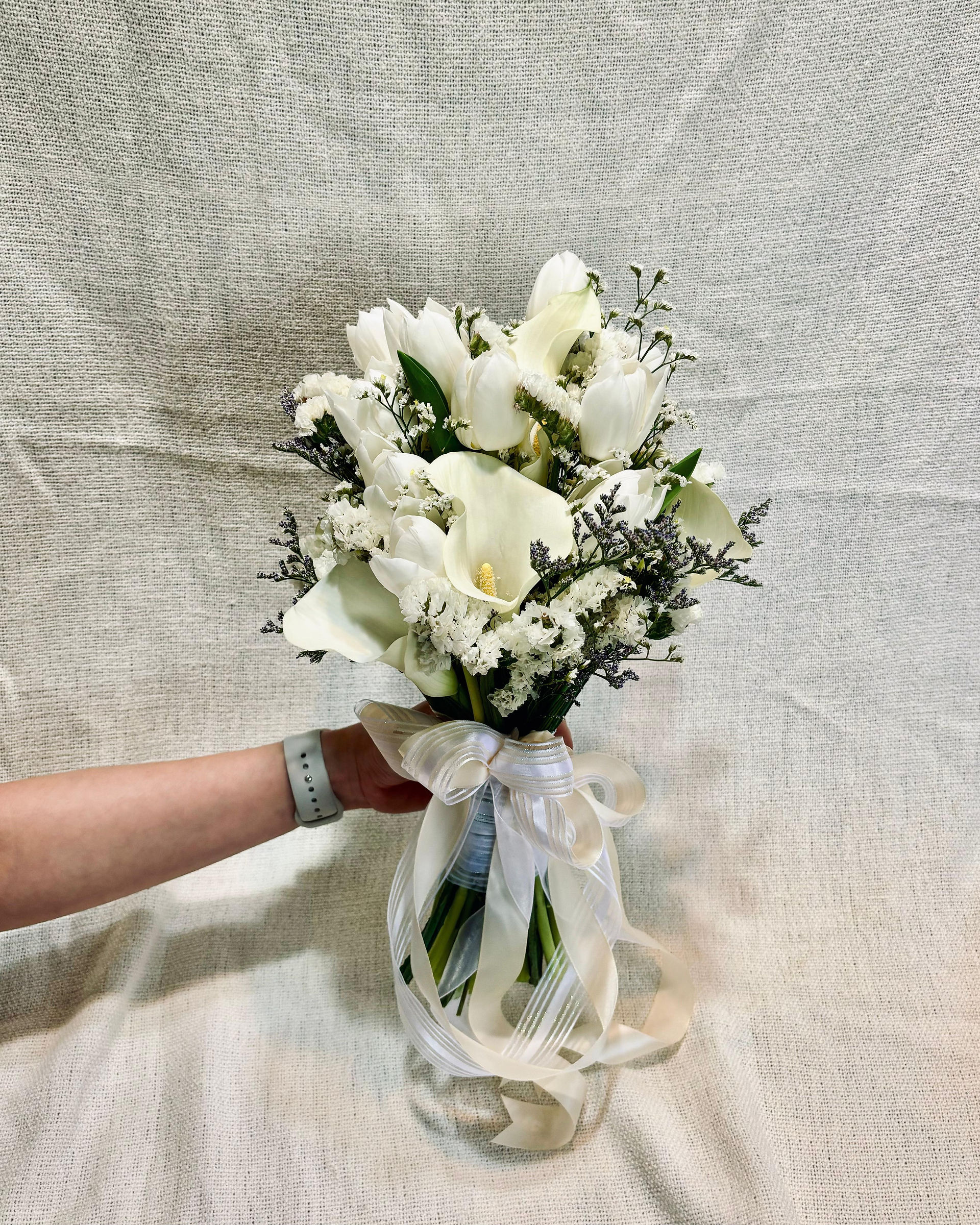 White cada lily bridal bouquet