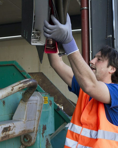 worker-at-a-waste-container-throwing-away-folders-e1653499923937-ppcgem3zo02qqwj9dzu88k8wx