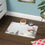 Thumbnail: Festive Pet Food Mat with Snowman Design