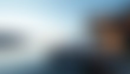 Eye-level view of a modern waterfront home with a dock on Puget Sound