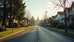Eye-level view of a modern Seattle neighborhood street with houses and trees