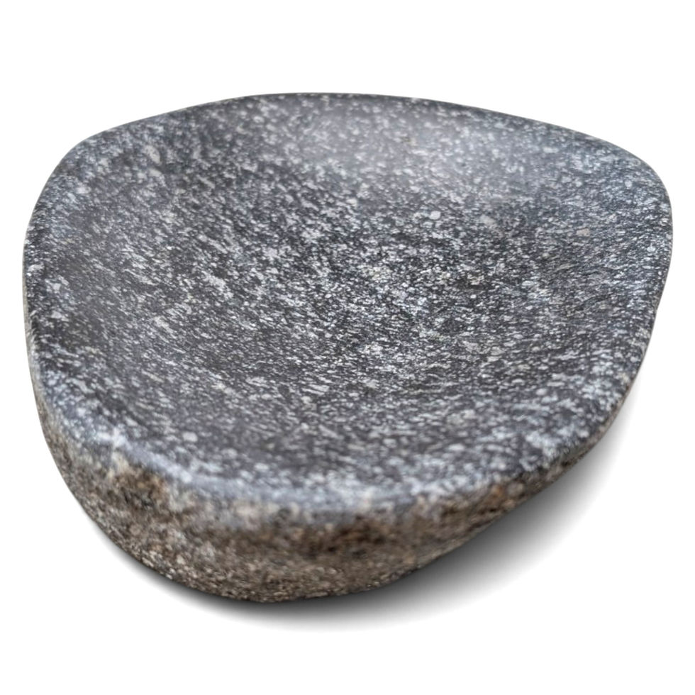 Angled view of a charcoal-gray river rock soap dish with a shallow center
