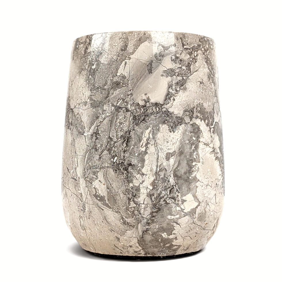 Thumbnail: Stone bathroom holder with varied coloring and markings