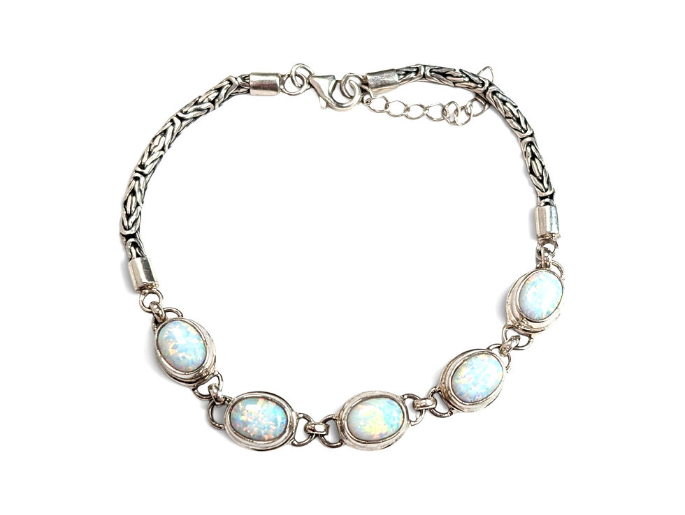 Silver tone opal bracelet featuring five oval cabochon stones