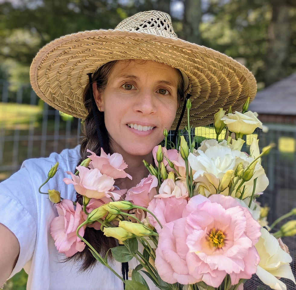Laura with an armful of pink and white lisianthus