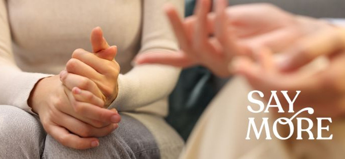 Close-up of hands in motion during conversation.