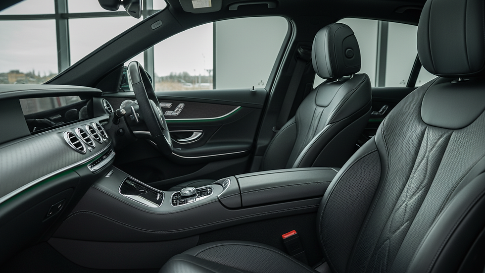 Close-up view of a luxury car interior showcasing leather seats and ambient lighting