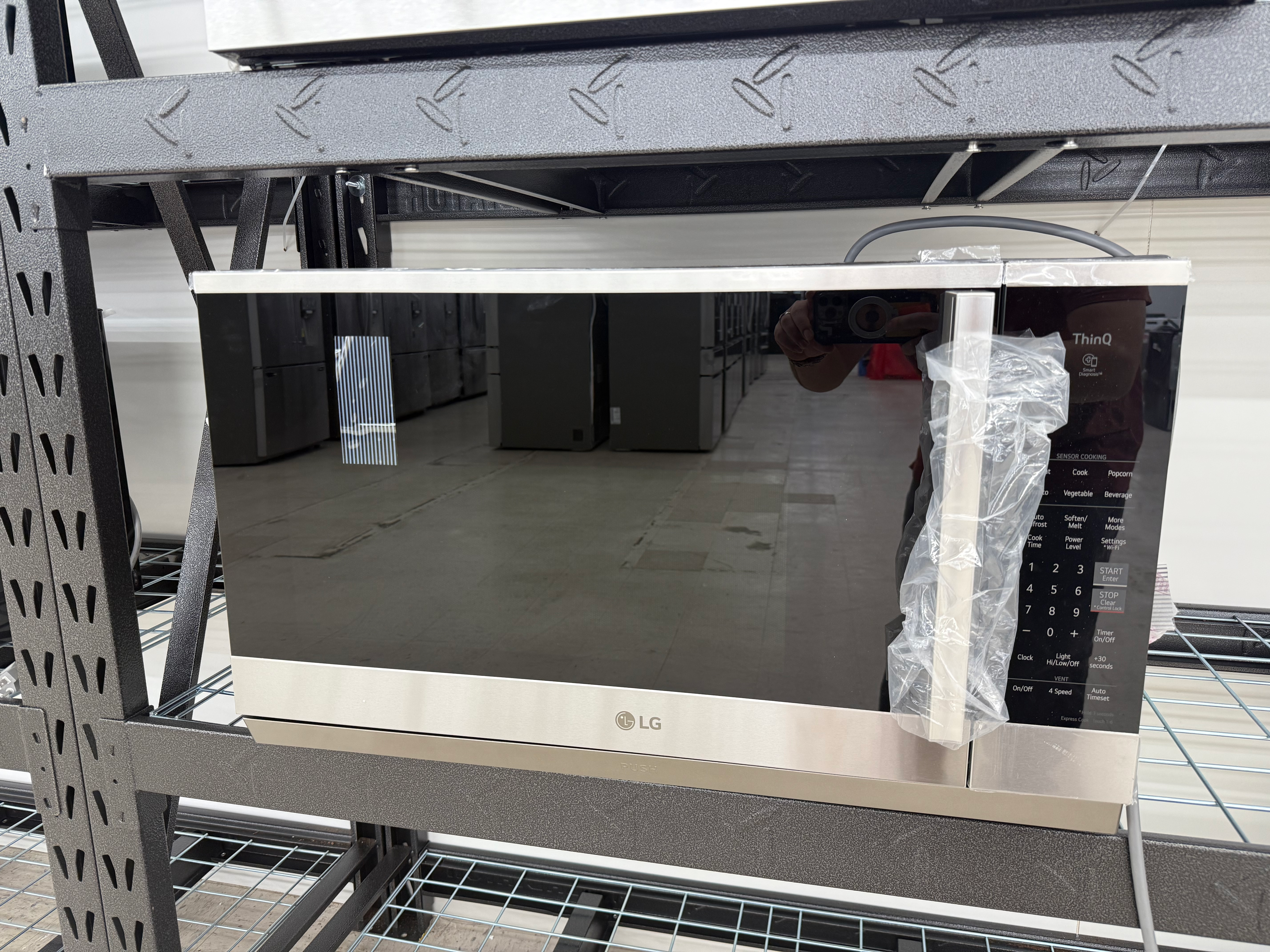 Smart 2.1 cu. ft. Stainless Steel Electric 1050-Watt Over-The-Range Microwave