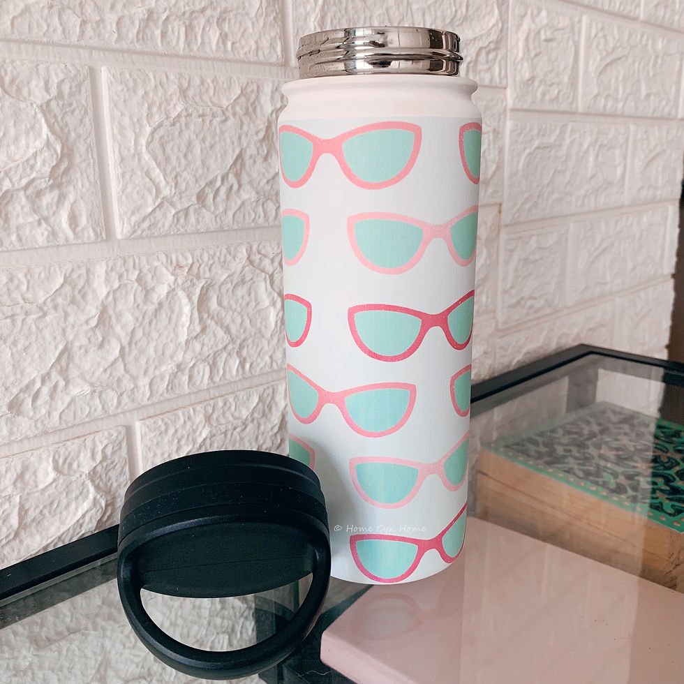 Home Cyn Home's mint and pink sunglasses design on a Society6 water bottle