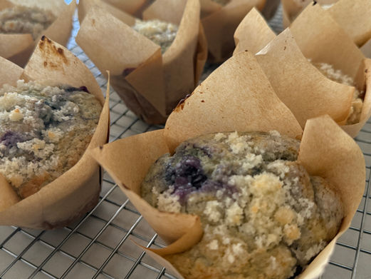 Fresh sourdough blueberry muffins with crumb topping, baked from scratch and fresh from the oven.
