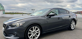 Bright blue car in puddle