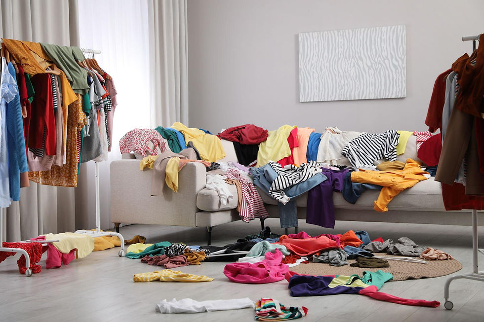 Eye-level view of a minimalist clothing rack featuring elegant garments
