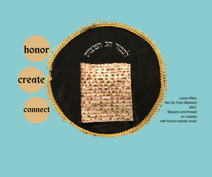 A square of white matzah embroidered with iridescent sequins.